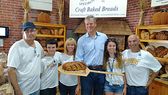 Gov. Charlie Baker visits the Robbins Family at the Pittsfield Rye booth at the 2015 Big E.