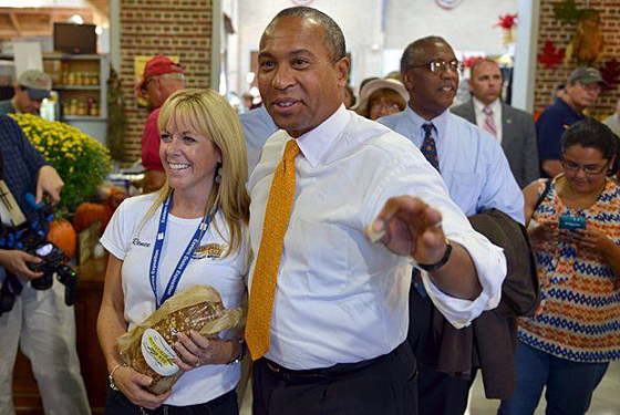 Gov. Deval Patrick makes a stop at the Pittsfield Rye booth and talks with Renee Robbins on Massachusetts Day at the Big E.